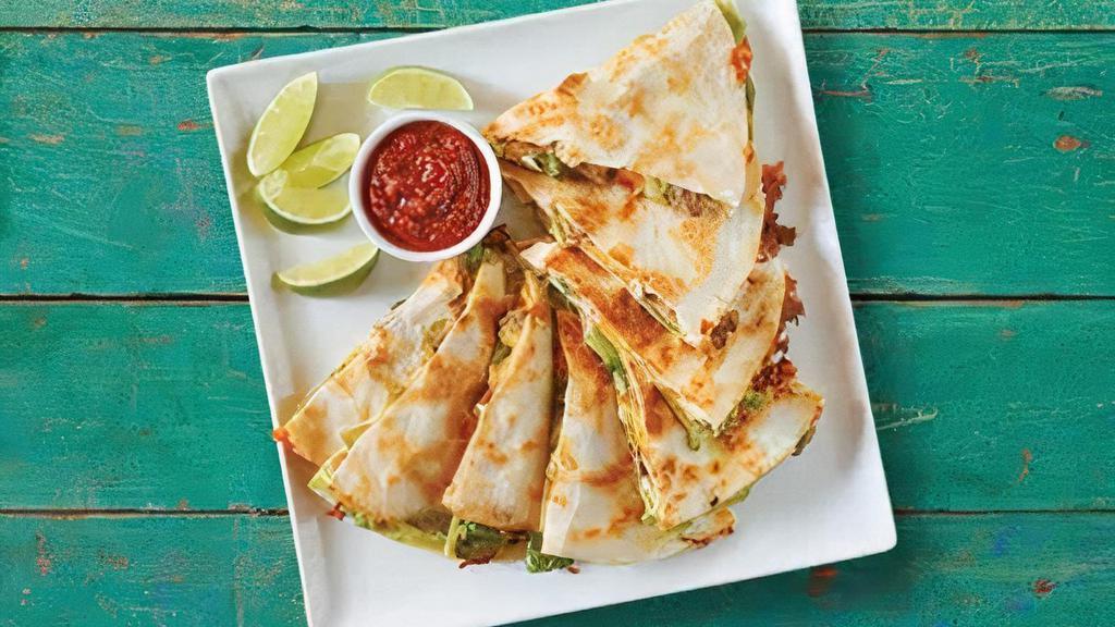 Super Quesadilla · 2 flour tortillas filled with guacamole, sour cream, lettuce, pico de gallo, triple cheese and choice of meat with a side of salsa