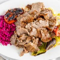 1. Lamb & Beef Gyro Plate · Thin cut lamb and beef gyro cooked on vertical grill, served with rice pilaf, house salad, p...