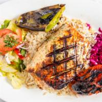 11. Grilled Salmon · Marinated grilled salmon served with rice pilaf house salad pickled red cabbage side of pita...
