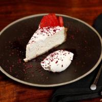 New York Cheesecake · NY style cheesecake, Piña colada style, with coconut cream, dried pineapple, and pineapple j...