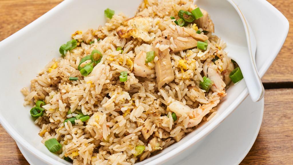 Chicken Fried Rice · With eggs. with scallions and side of hot sauce.