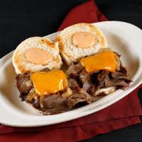 Prime Rib Sliders · Thinly sliced prime rib, sauteed onions, Cheddar cheese, and thousand island dressing on a t...