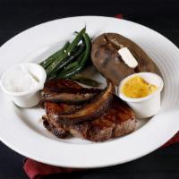 Filet Mignon (10 oz) · Grilled portobello mushrooms and béarnaise sauce. Served with seasonal vegetables.