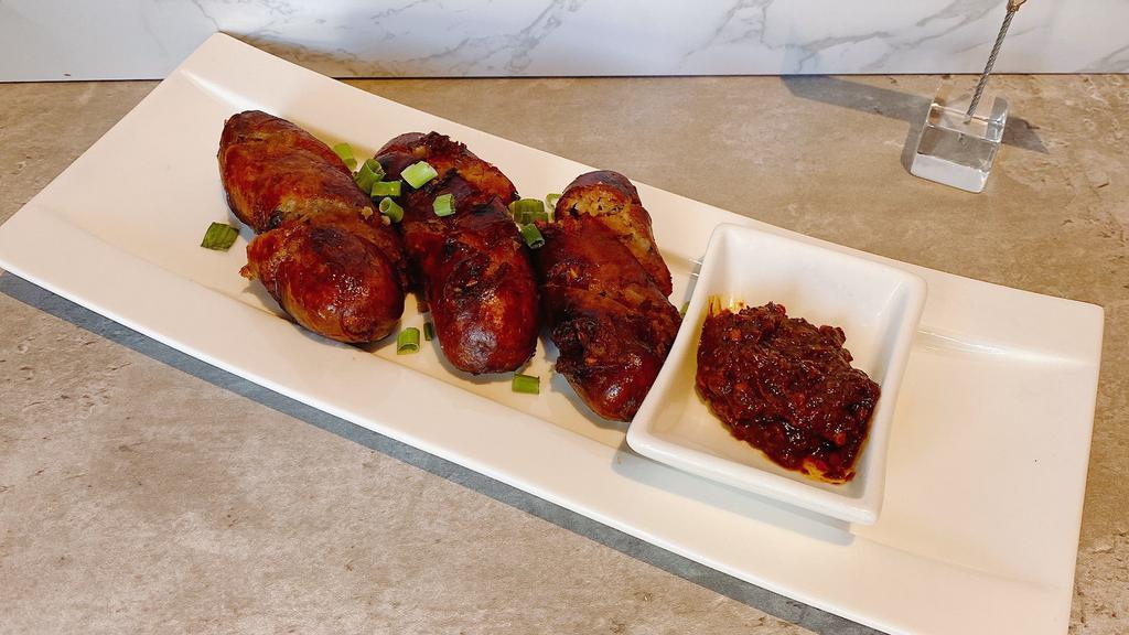 A6. Lao Style Sausages · Spicy. Deep-fried pork sausages with lemon grass and kaffir lime leaf.