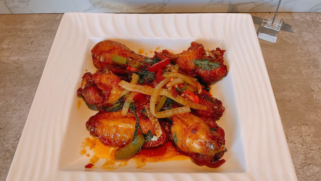 A11. Sweet & Sour Basil Wings · Double fried wings tossed in house sweet and sour sauce and basil.