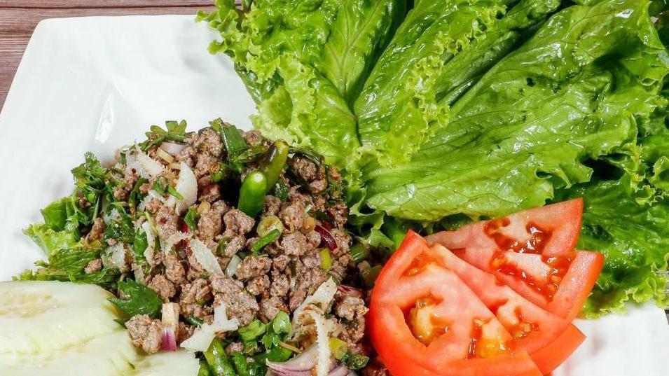 B2. Laap Salad · Choice of protein with mint, onion, cilantro tossed in roasted rice powder and lime juice. Beef option comes with tripe.