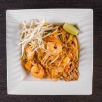 E4. Pad Thai · Pan fried rice noodle with egg, tofu, bean sprouts, and choice of protein. Garnished with a ...