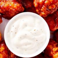 Hot Wings · Fresh chicken wings marinated in a pepper seasoning and served with choice of dipping sauce.