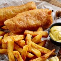 Fish & Chips · Crispy golden fresh caught fish served with French fries.