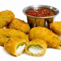 Jalapeño Poppers · Crispy golden jalapenos stuffed with creamy cheese and served with savory marinara dipping s...