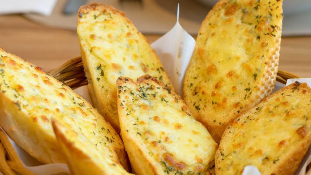 Garlic Bread with Cheese · Fresh baked garlic bread topped with melted mozzarella cheese.