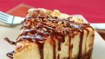 Caramel Fudge New York Cheesecake · Fresh baked cheesecake with a creamy caramel fudge qfilling and buttery crust.
