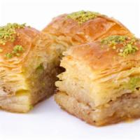 Pistachio Baklava · Two pcs traditional filo pastry with layers of chopped pistachio and sweet syrup.