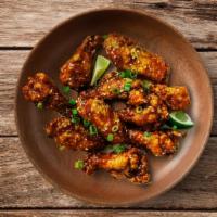 Mango Habanero Wings · Classic wings fried and then tossed in our new Mango Habanero sauce.