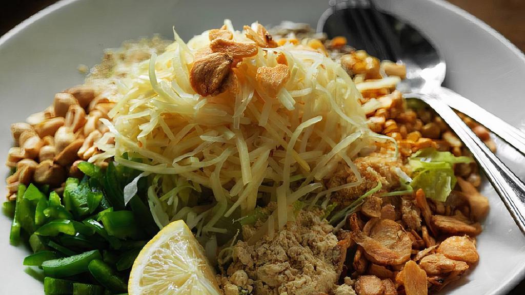 6.	Crunchy Coconut and Ginger Salad^ · Crunch coconut mixed w/ pickled ginger, fried garlic, assorted beans, peas, peanuts, sesame seeds, tomatoes, cabbage, lemon juice & dried shrimp powder
