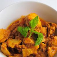 22.	Shwe Myanmar Coconut Chicken Curry w/ Potatoes · Slow cooked chicken & potatoes w/ coconut curry paste