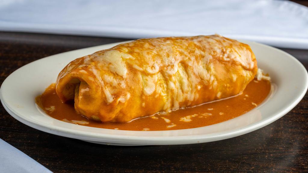Enchirito Burrito · Your choice of meat; includes rice, beans, cheese, sour cream and salsa( pico de gallo) on a flour tortilla. Topped with our signature enchilada sauce and melted cheese.