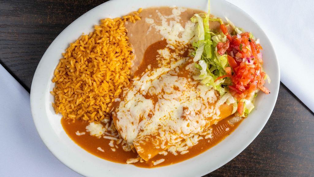 Two Enchiladas · Your choice of TWO cheese, chicken or beef enchiladas covered with our signature sauce. Served with rice, beans, cheese and salsa (pico de gallo).