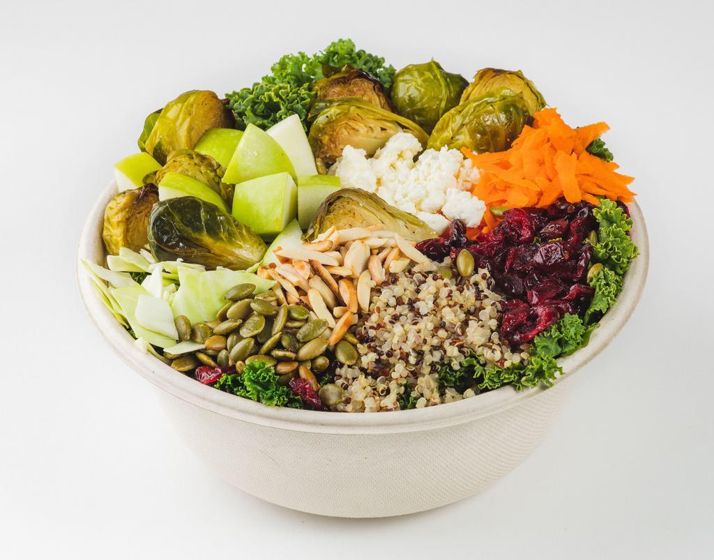 Brussels, Kale & Quinoa · Massaged kale, roasted brussels sprouts, tri-color quinoa, carrots, cabbage, granny smith apples, dried cranberries, feta & toasted pumpkin seeds with meyer lemon vinaigrette. Vegetarian, Gluten- Free.