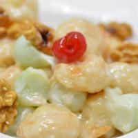 Walnut Prawns 核桃蝦 · Deep-fried prawns mixed in honey mayonnaise, walnuts and honeydew melon with a cherry on top...