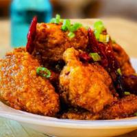 Dry Fried Chicken Wing 幹烹雞翅 · Deep-fried wings mixed into our delicious sweet and spicy sauce with chili peppers and green...