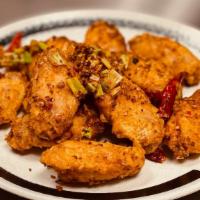 Ma La Wings 麻辣雞翅 · Crispy wings stir-fried with Sichuan peppercorn, pickled pepper and green onions. Spicy.