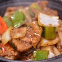 Black Pepper Beef 黑椒牛 · Beef slices stir-fried with bell peppers, white onions and black pepper in brown sauce. Spicy.