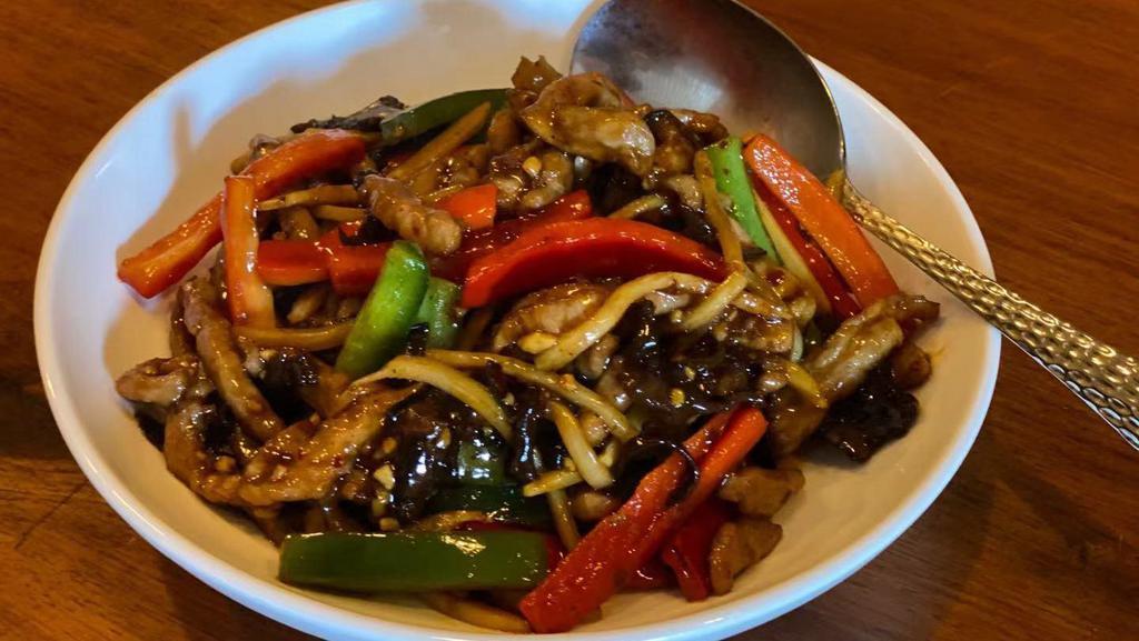 Yu Xiang Pork 魚香肉絲 · Shredded pork, bamboo shoots, black fungus, and bell peppers stir-fried in spicy garlic brown sauce. Spicy.