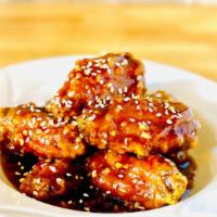 Sesame Wings 芝麻雞翅 · Deep-fried chicken wings mixed in our delicious sweet vinaigrette  sauce. Non-spicy.
