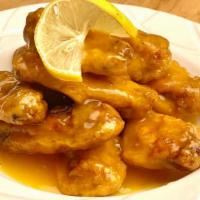 Lemon Wings 檸檬雞翅 · Deep-fried chicken wings mixed in our lemon zesty sauce. Non-spicy.