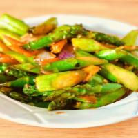 Black Bean Asparagus 豆豉利筍 · Fresh asparagus, onions and carrot stir-fried in black bean sauce. Vegan and non-spicy.