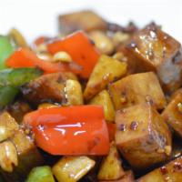 Kung Pao Meatless Chicken 宮保素雞 · Meatless chicken stir-fried with bell peppers, chili peppers and peanuts in our delicious br...
