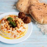 Hummus Bowl · Fresh Hummus made daily, topped with garbanzo beans, tahini, two falafel balls and olive oil...