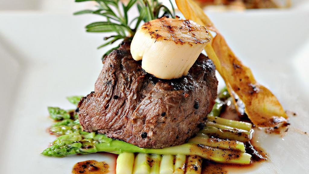Filet Mignon & Scallops · Tasty and oh-so Tender Filet Mignon that just melts in your mouth, paired with flavorful Scallops cooked to perfection. Comes with Steamed Sautéed Vegetables and your choice of Creamy Mashed Potatoes with Gravy or Roasted Yams.
