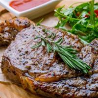 Ribeye Steak · Grilled ribeye steak marinated with garlic, rosemary, sage, olive oil, salt, and pepper serv...