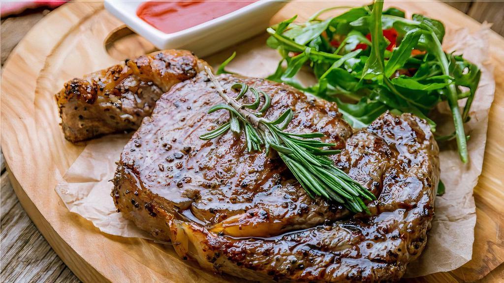 Ribeye Steak · Grilled ribeye steak marinated with garlic, rosemary, sage, olive oil, salt, and pepper served with mash