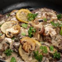 Scaloppine di Vitello · Veal tenderloin with mushroom. Served with vegetables and mash potato in a lemon caper butte...