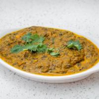 Palak Paneer · Gravy cottage homemade cheese and creamed spinach cooked with garam masala.