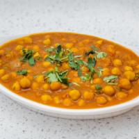 Chana Masala · Vegetarian. Spicy chickpeas cooked in tomato and onion gravy with Indian spices.