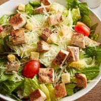 Chicken Caesar · Caesar dressing. Romaine lettuce, Parmesan cheese, cucumbers, tomatoes, and croutons.