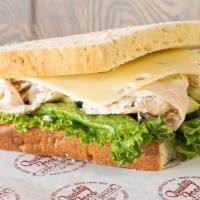 Turkey & Swiss · Oven-roasted turkey breast with swiss cheese, lettuce, and our signature sauce. Served on ho...