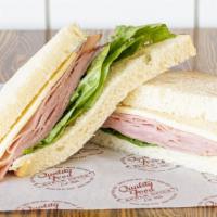 Ham and Havarti · Cured ham and havarti cheese with green leaf lettuce and our signature sauce. Served on sour...