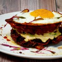 Egg Tower · A crispy and freshly made hash brown/potato cake at the base of the egg tower. Added a sprea...