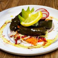 Dolmades · Vegan, Vegetarian, Dairy Free, Soy Free, Peanut Free. Grape leaves stuffed with a homemade r...