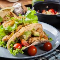 2 Taqueria Chicken Tacos · 2 Delicious street tacos packed with seasoned chicken, chopped onions, fresh chopped cilantr...
