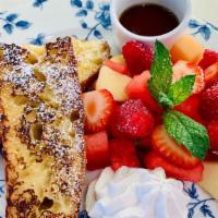Pain Perdu · Orange-blossom baguette french toast. Served with fresh fruit salad, crème chantilly, maple ...