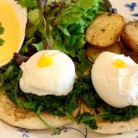 Œufs Florentine · Spinach, poached eggs, English muffins. Served with mixed greens, roasted potatoes, Hollanda...