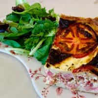 Quiche Lorraine · Ham, bacon, swiss cheese. Served with mixed green salad