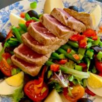 Tuna Niçoise Salad · Fresh pan-seared tuna, boiled egg, bell pepper, French string beans, tomato, potato, olives