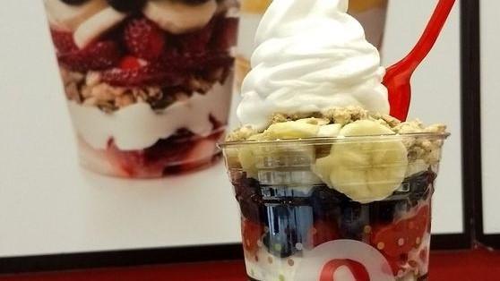 Yogurt Parfait · Yogurt Parfait, topped with granola, honey, strawberry, bananas, and blueberries